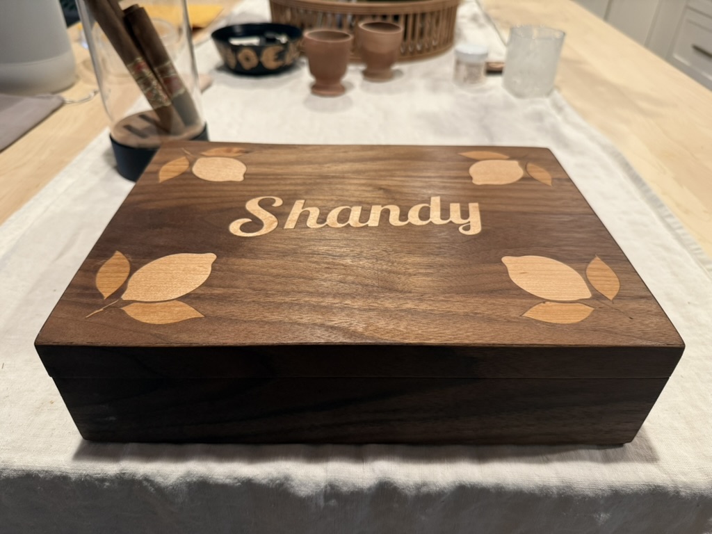 Walnut humidor with maple leaf inlay and the name Shandy