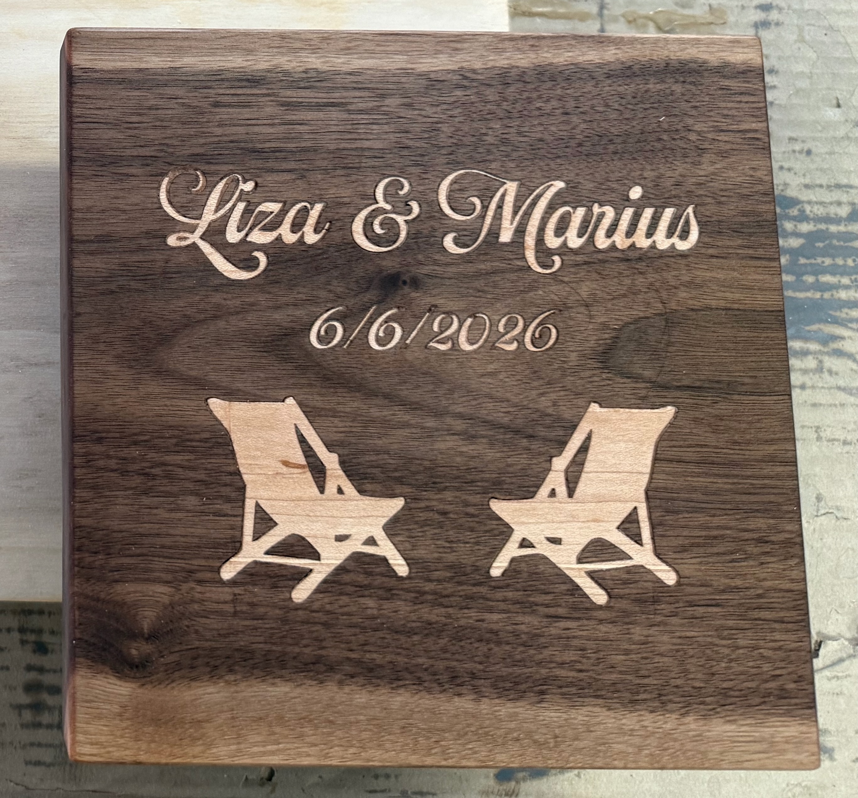 Walnut keepsake box top engraved Liza and Marius 6/6/2026 with two maple beach chairs